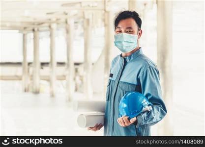 Factory worker with face mask protect from outbreak of Coronavirus Disease 2019 or COVID-19.
