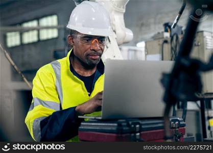 Factory worker working with laptop computer to do adept procedure checklist . Factory production line operator occupation quality control concept .. Factory worker working with laptop computer to do adept procedure checklist