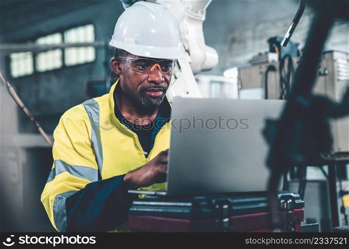 Factory worker working with laptop computer to do adept procedure checklist . Factory production line operator occupation quality control concept .. Factory worker working with laptop computer to do adept procedure checklist