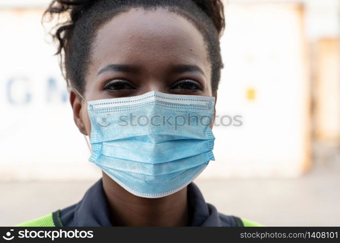 Factory workers with face mask protect from outbreak of Coronavirus Disease 2019 or COVID-19. Concept of protective action and quarantine to stop spreading of Coronavirus Disease 2019 or COVID-19.