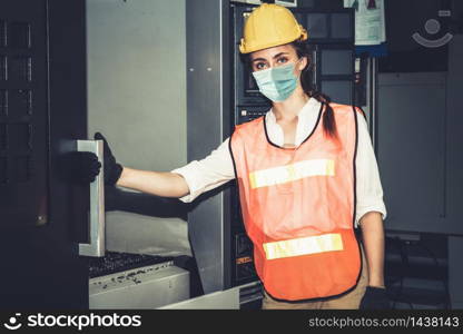 Factory workers with face mask protect from outbreak of Coronavirus Disease 2019 or COVID-19. Concept of protective action and quarantine to stop spreading of Coronavirus Disease 2019 or COVID-19.