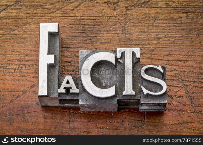 facts word in vintage metal type printing blocks over grunge wood