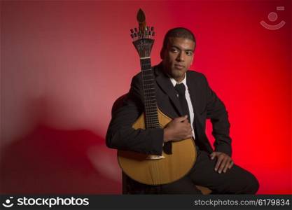 fado musician with a portuguese guitar, studio