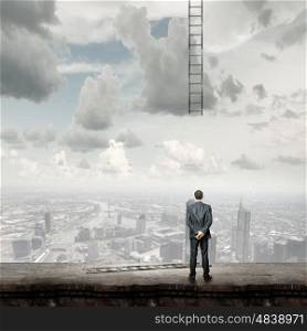 Failure in business. Rear view of businessman and broken ladder to sky