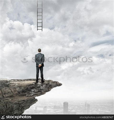 Failure in business. Rear view of businessman looking at broken ladder