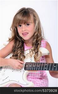 fair-haired little girl playing bass