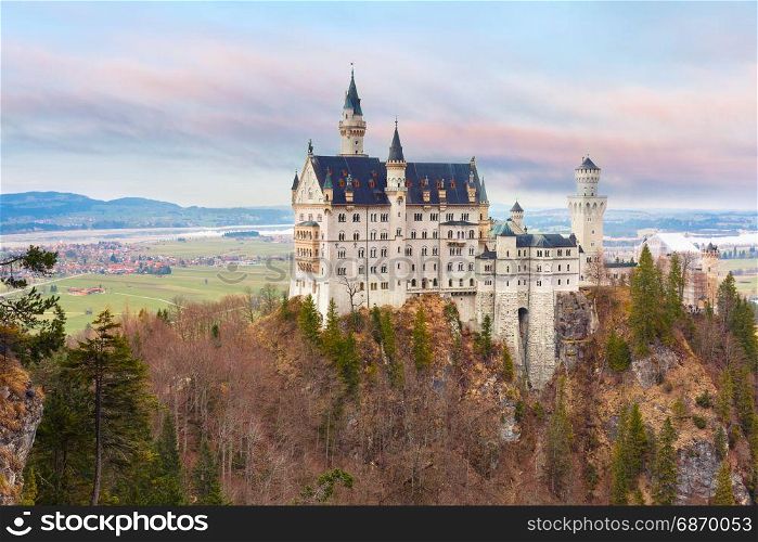Fairytale Neuschwanstein Castle, Bavaria, Germany. World-famous tourist attraction in the Bavarian Alps, fairytale Neuschwanstein or New Swanstone Castle, the 19th century Romanesque Revival palace at sunset, Hohenschwangau, Bavaria, Germany