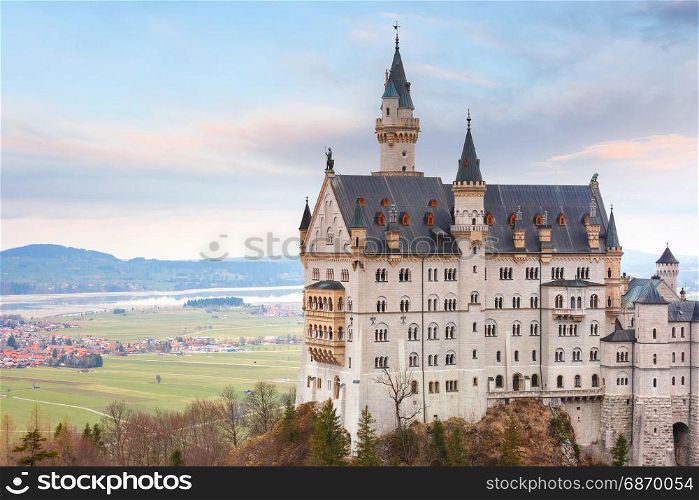 Fairytale Neuschwanstein Castle, Bavaria, Germany. World-famous tourist attraction in the Bavarian Alps, fairytale Neuschwanstein or New Swanstone Castle, the 19th century Romanesque Revival palace at sunset, Hohenschwangau, Bavaria, Germany