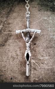 Faith concept with close up of silver cross crucifix