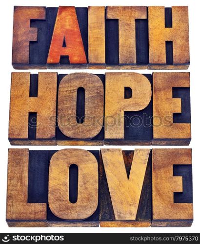 faith, hope and love - a collage of isolated words in vintage letterpress wood type stained by color inks
