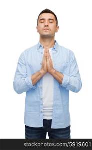 faith in god, religion and people concept - happy man with closed eyes praying