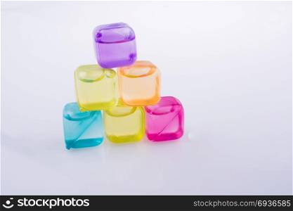Fake colorful ice cubes on a white background