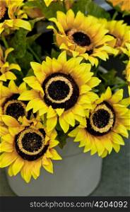 fake sunflowers in a pot, close up