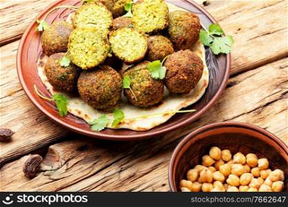 Falafel deep-fried balls made from chopped legumes or chickpeas. Falafel balls,vegetarian dish