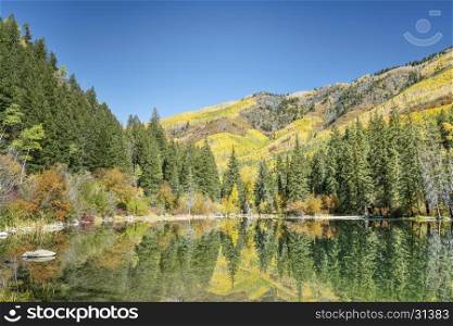 fall colors reflections in Lizard Lake near Marble, Colorado