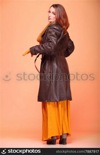 Fall. Fashion woman in autumn color fresh girl in full length long false orange eye-lashes