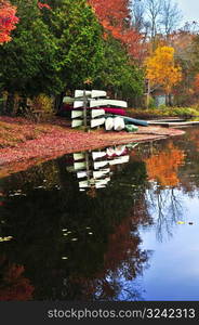 Fall forest reflections with canoes