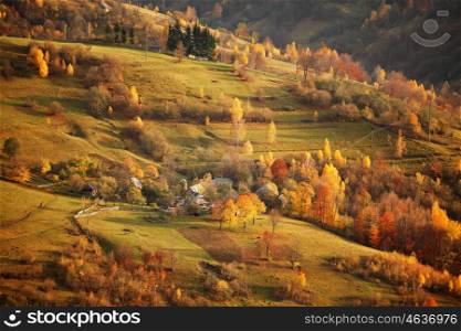 Fall in mountain village. Alpine October scene.
