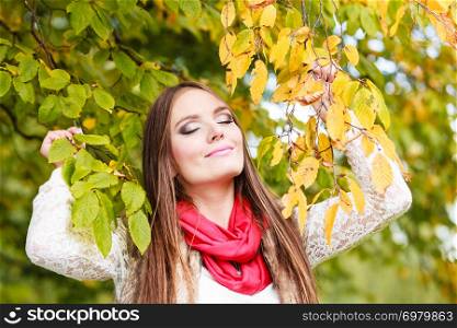 Fall lifestyle concept, harmony freedom. Attractive young woman fashion girl long hair relaxing walking in autumnal park, outdoor