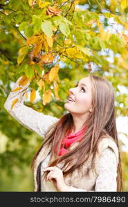 Fall lifestyle concept, harmony freedom. Attractive young woman fashion girl long hair relaxing walking in autumnal park, outdoor