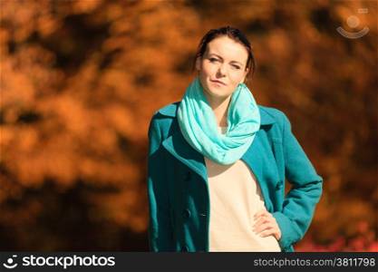 Fall lifestyle concept, harmony freedom. Portrait young woman girl relaxing walking in autumnal park. Golden colorful leaves background