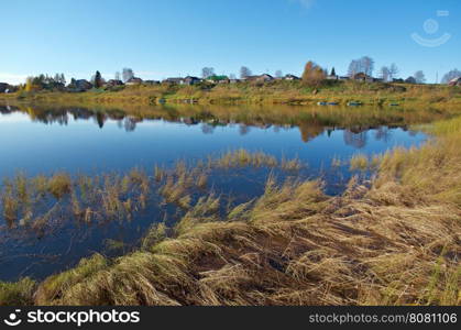 Fall River, reflected in the water autumn trees. Arkhangelsk region, Russia