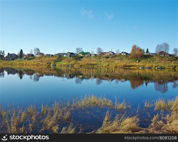 Fall River, reflected in the water autumn trees. Arkhangelsk region, Russia
