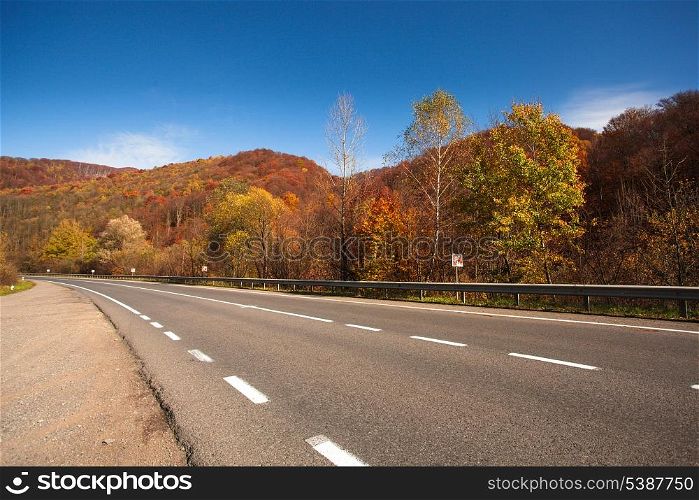 Fall road between the mountains in Carpathians