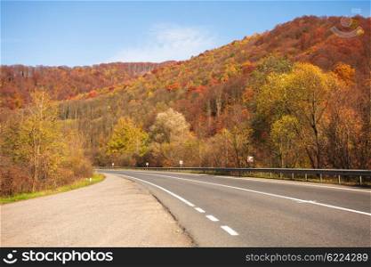 Fall road between the mountains in Carpathians. The Fall road