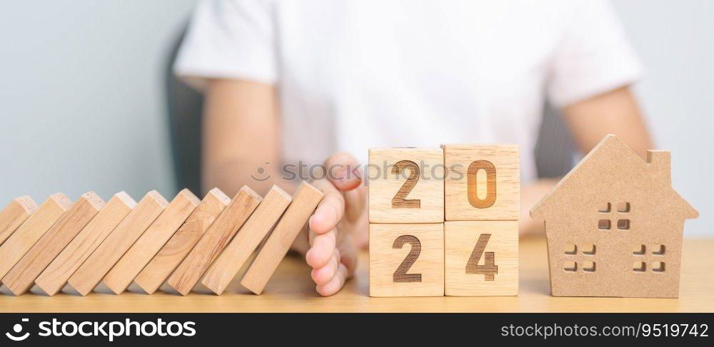 falling blocks with 2024 Year protect house miniature. Inflation financial, Home Insurance, investment, Crisis, Economic recession, New Year, Real Estate and Property concept