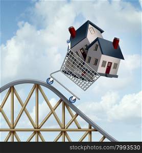 Falling home prices and declining real estate value financial concept as sold houses in a shopping cart going down a roller coaster as a business financial concept as low or lower mortgage residential loan rates and buying your family dream home.