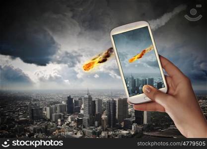 Falling meteorite. People taking photos of falling meteorite on mobile phone camera