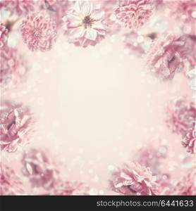 Falling or flying pastel pink flowers background or frame, creative layout with copy space for design