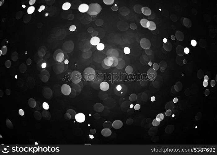 Falling snow background - snowflakes over night dark sky