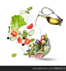 Falling vegetables for salad and olive oil isolated on white