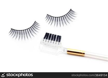 False eyelash mascara and make-up brush isolated on white