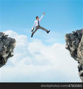 False risk for your business. Concept of false danger with businessman jumping above gap