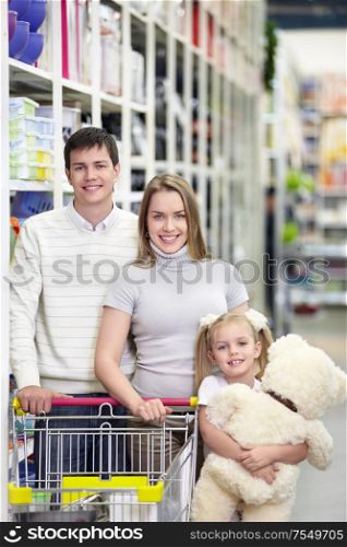 Families with a child makes a purchase in a store