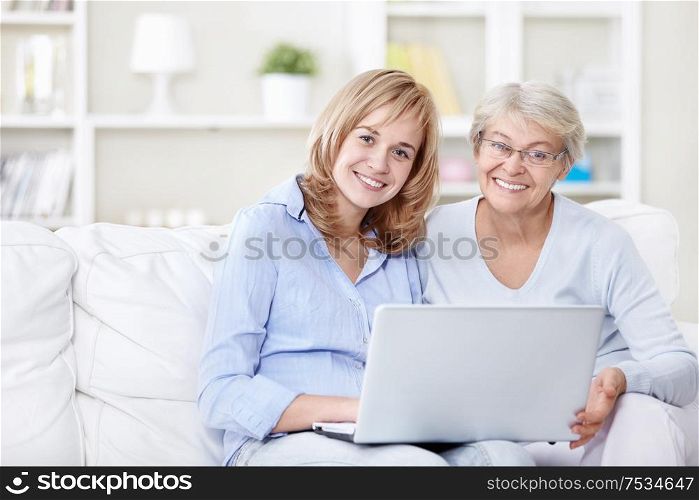Families with a laptop on the couch