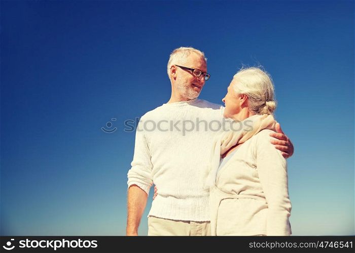 family, age and people concept - happy senior couple talking outdoors