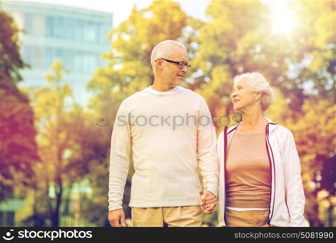 family, age, tourism, travel and people concept - senior couple in city park. senior couple in city park