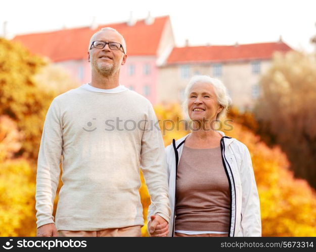 family, age, tourism, travel and people concept - senior couple in city park