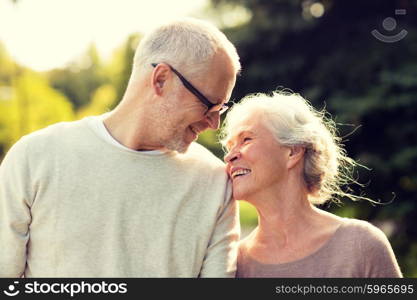 family, age, tourism, travel and people concept - senior couple in park