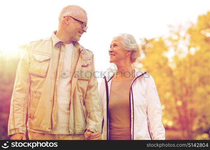 family, age, tourism, travel and people concept - senior couple in park. senior couple in park