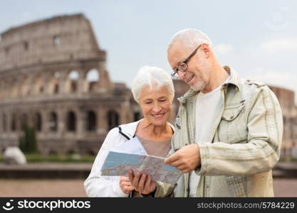 family, age, tourism, travel and people concept - senior couple with map and city guide on street over coliseum background