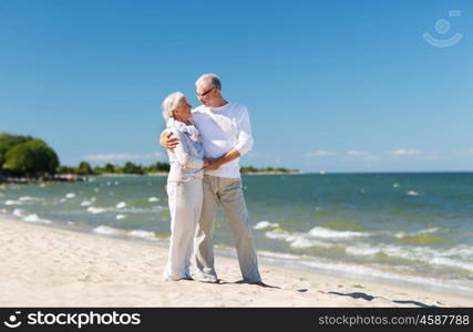 family, age, travel, tourism and people concept - happy senior couple holding hands on summer beach