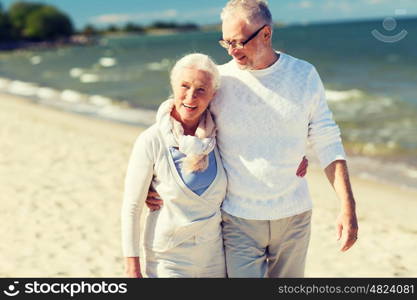 family, age, travel, tourism and people concept - happy senior couple hugging on summer beach