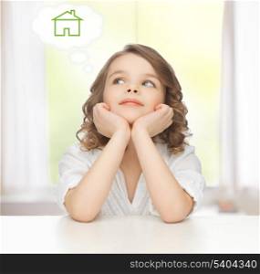 family and new home concept - pre-teen girl dreaming about the house