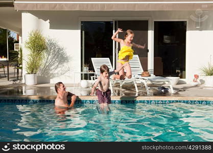 Family and outdoor swimming pool