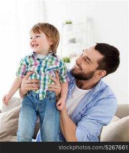 family and people concept - happy father with little son at home. happy father with little son at home